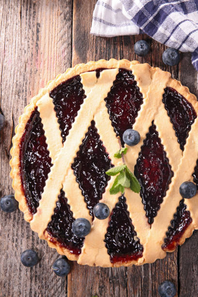 istock blueberry tart on wood background 930312554