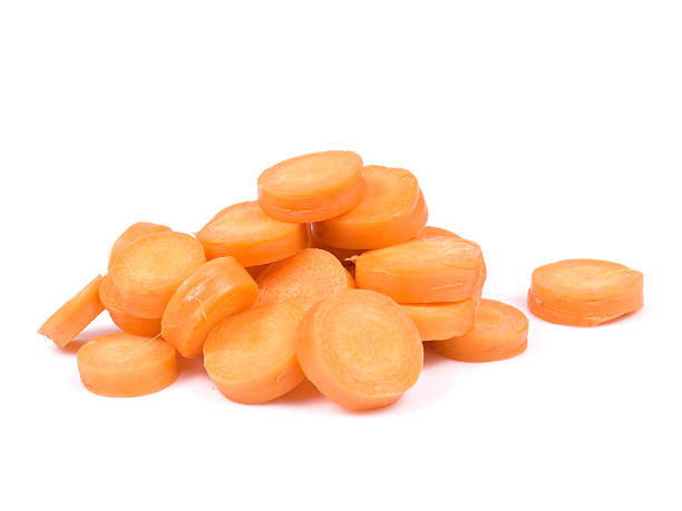 slices of fresh carrot on the white background