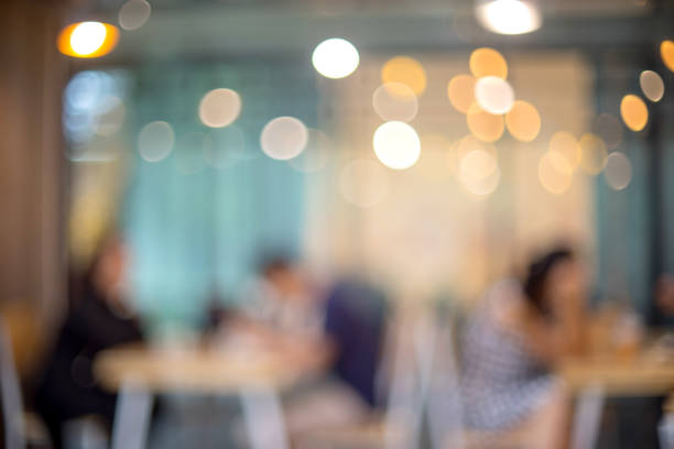 istock blur image of restaurant with people sit in shop 930334636