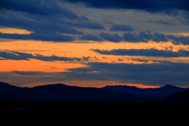 istock sunset beautiful and silhouette mountain tree colorful landscape in sky twilight time 930335014