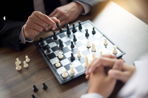 istock Businessman thinking how to play chess concept business strategy 930336294