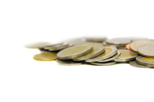 istock piles of coin on white background. macro focus 930339332