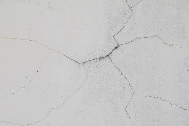 istock old white concrete crack wall and copy space for add text 930339340