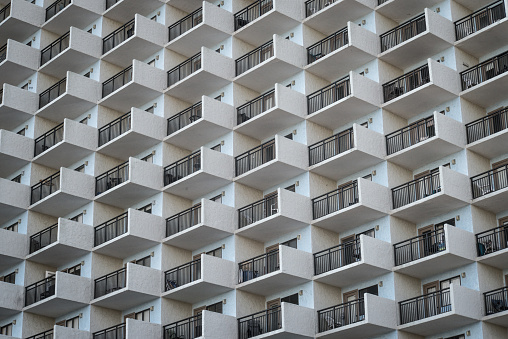 Identical condos reach into the sky in an urban coastal community.