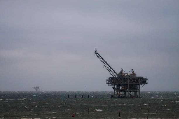 istock Offshore oil Rig in stormy winter evening 930371158