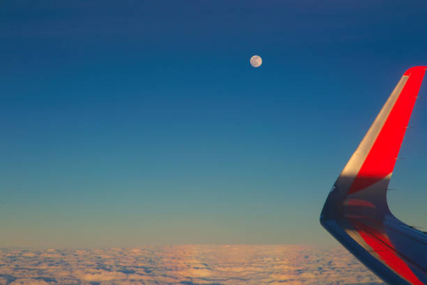 istock Moon and wing of airplane 930378550