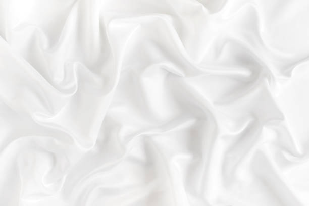 istock Close up of ripples on white silk fabric. Satin textile background. 930381436