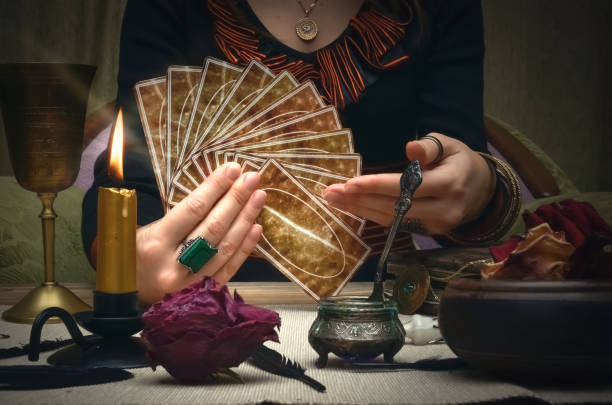 istock Tarot cards on fortune teller desk table. Future reading concept. 930385054