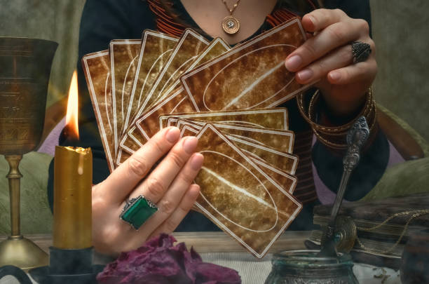 istock Tarot cards on fortune teller desk table. Future reading concept. 930385064