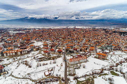 Wide drone shot from the sky of winter landscape in Bansko, Bulgaria tourist ski resort