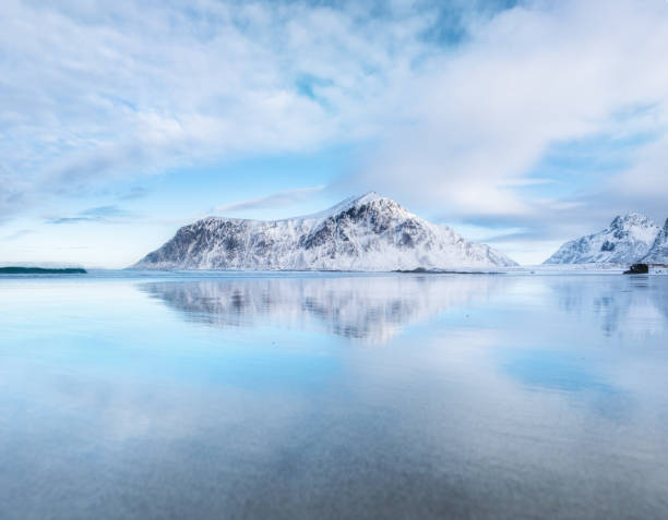 istock Mountain ridge and reflection on the seashore. Natural landscape in the Norway 930389846