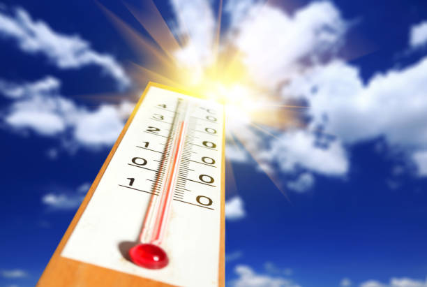 istock Thermometer with sunshine over blue sky 930392454