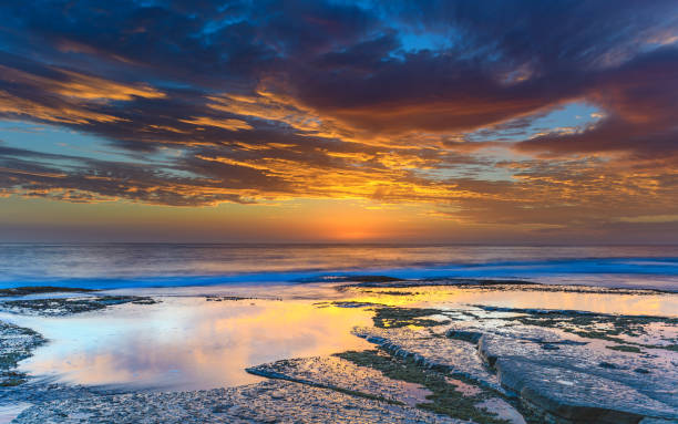 istock Cloudy and Vibrant Sunrise Seascape 930392712