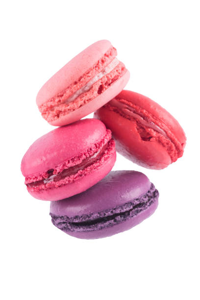 istock 4 delicious pink cookies falling down isolated on white 930402340