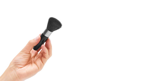 istock make-up brush in hand isolated on white background. copy space, template 930406196