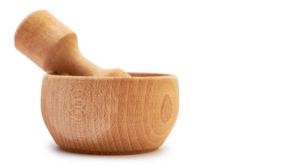 istock Wooden mortar with sea salt for cooking. Isolated on white background. copy space, template 930406452