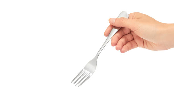 istock Female hands hold a fork. Isolated on white background. copy space, template 930406524