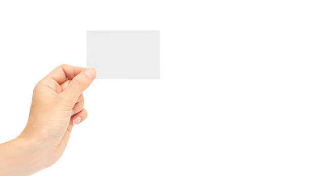 istock Female hands hold a business card. Isolated on white background. copy space, template 930406592