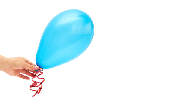 istock Female hand holds single blue party balloon. isolated on white background. copy space, template. 930406890