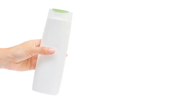 istock Hand holding shampoo bottle isolated on white background. copy space, template 930406924