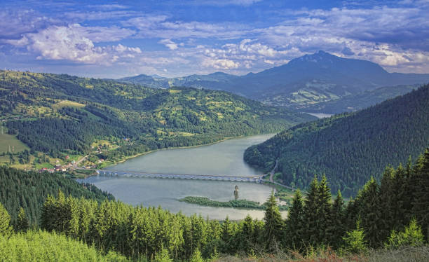 istock mountain landscape with lake and bridge. 930416810