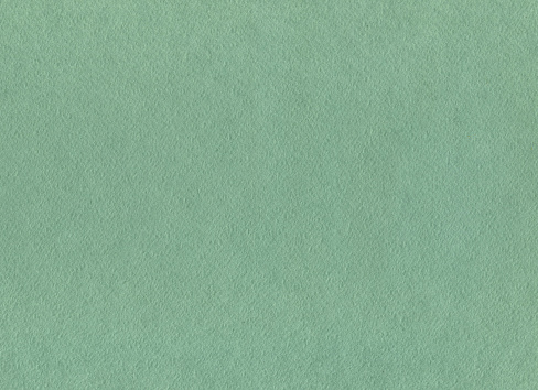Closeup of green watercolor paper texture or background