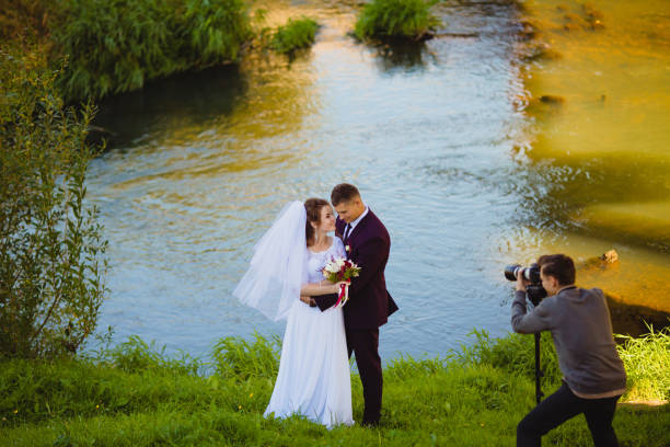 Wedding photoshoot near the river stock photo