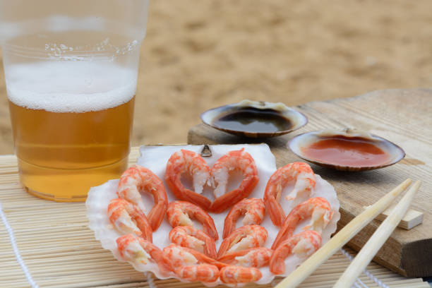 Sunny morning by the sea, we are have a breakfast from boiled shrimp and drink. Japan style.
