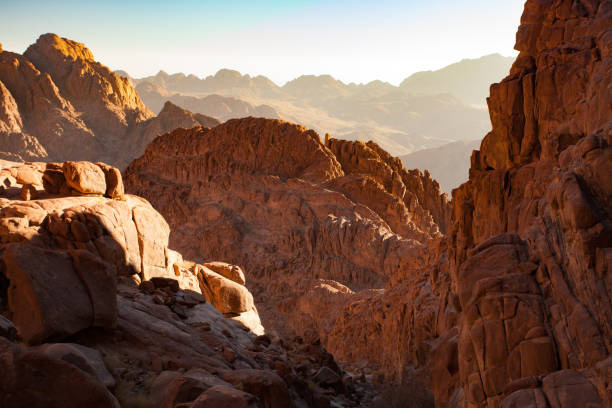 Mountains lit by first rays of sun at sunrise. Sinai mountains in Egypt lit by first rays of sun at sunrise. egypt horizon over land sun shadow stock pictures, royalty-free photos & images