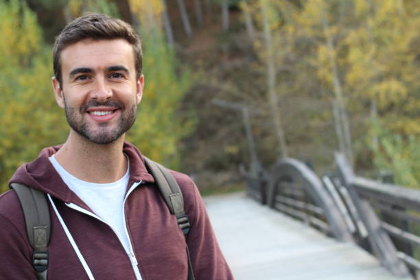 istock Smiley male walking through a bridge 930439288