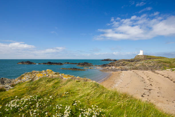 istock Llanddwyn Island Lighthouse in Anglesea, Wales, UK 930444028