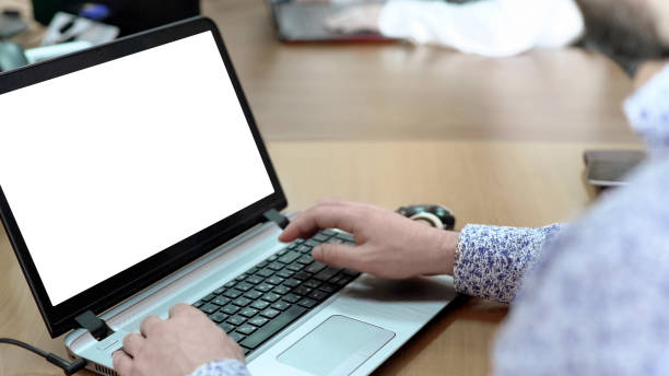 istock Male employee working on laptop at office desk, developing business project 930444232