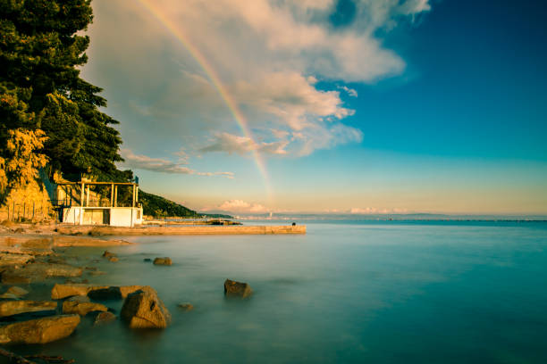 A spring storm with a colorful rainbow in the gulf of Trieste