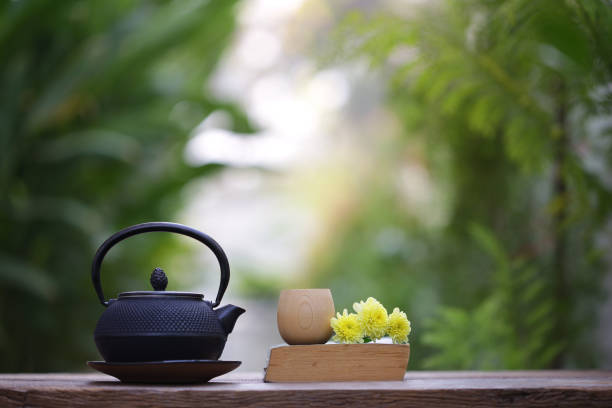 istock Black vintage teapot and cup with diary at outdoor 930455198