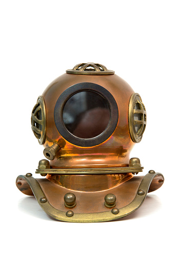 Old brass heavy diving mask isolated over white