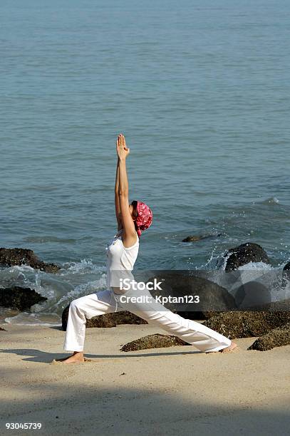 Virabhadrasana Hatha Yoga By The Beach Stock Photo - Download Image Now - Beach, Color Image, Flexibility