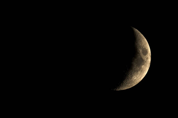 istock High contrast Waxing crescent moon seen with telescope 930459186