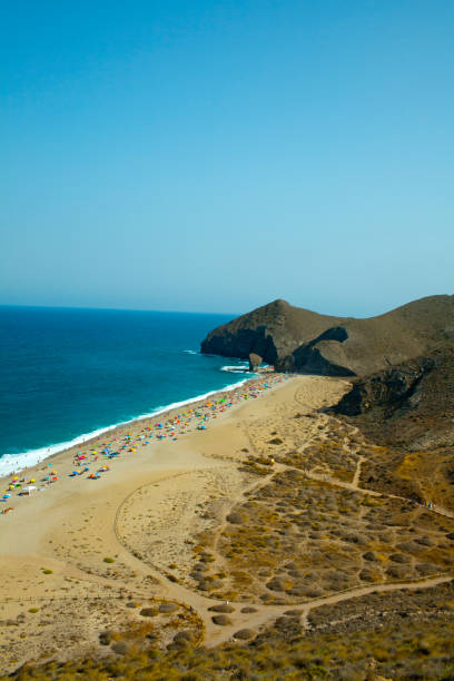 istock Scenic volcanic beach in mediterranean sea. 930471594