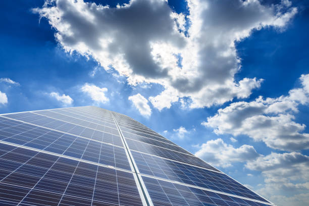 istock solar panels and sky background,green energy 930471922