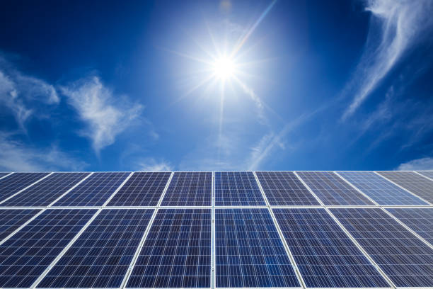 istock solar panels and sky background,green energy 930472110