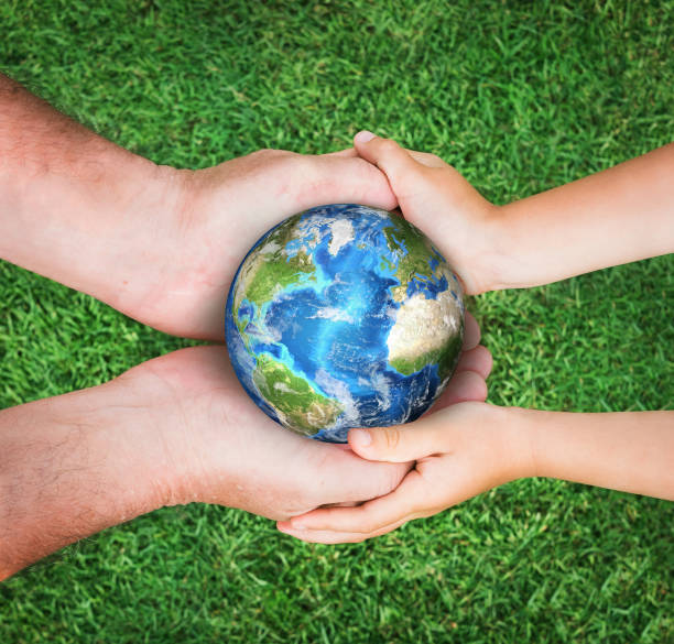 istock The man holding planet Earth with baby 930472824