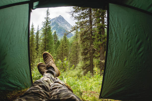 istock ourist tent camping in the mountains 930476464