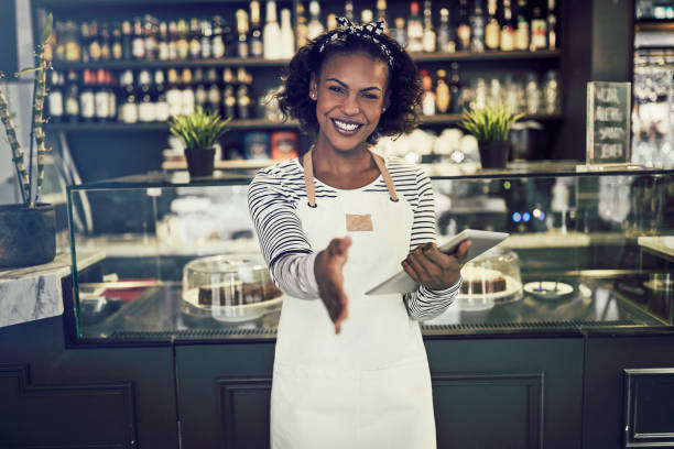 istock Welcoming African entrepreneur standing in her cafe 930479976