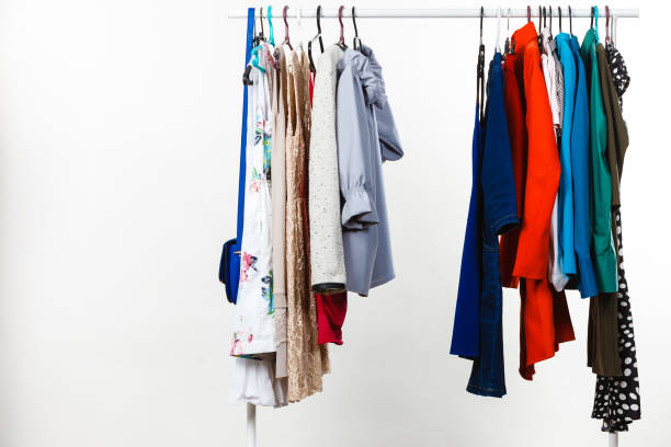istock Clothes on hangers in closet 930484956