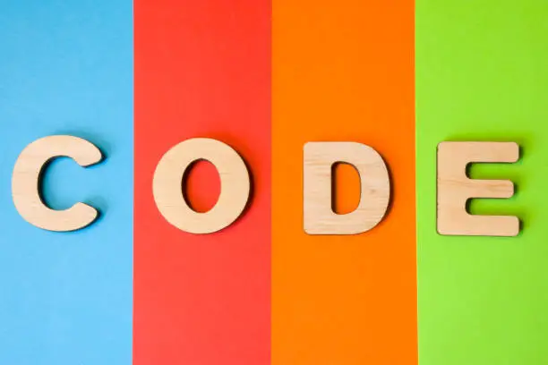 Word code is composed of 3D letters is in background of 4 colors: blue, red, orange and green. Illustration of code language for programming on internet, programs for desktops, mobile application