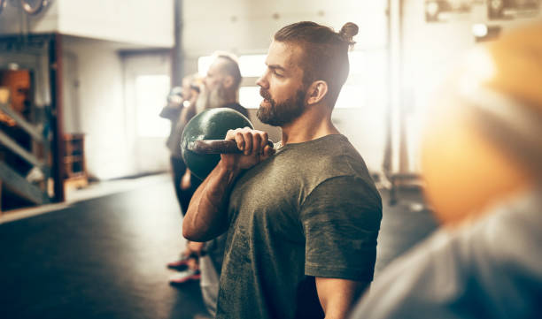 istock Fit people working out with dumbbells in a gym class 930487904
