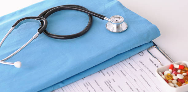 istock A stethoscope shaping a heart on a medical uniform, closeup 930489144
