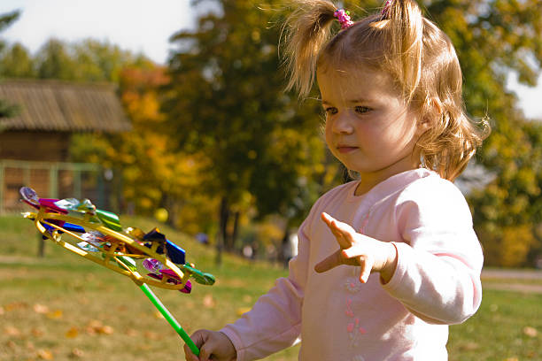 Little girl is in the park stock photo