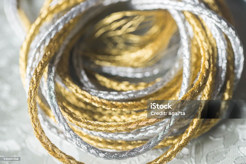 Silver And Gold Twine On Silverbackground Stock Photo - Download Image Now  - Gold - Metal, Gold Colored, Thread - Sewing Item - iStock