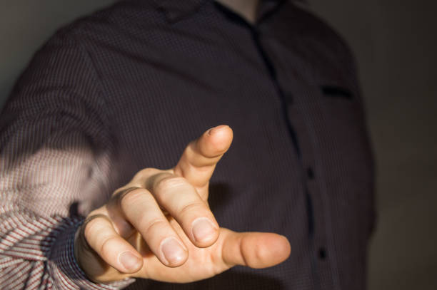 istock Businessman pointing finger at blank virtual screen by pressing a virtual button 930495532